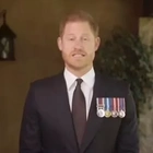 Prince Harry puts on his medals to present soldier of the year award in video message