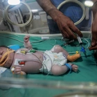 < 'Struggle, struggle, struggle.' What new and expecting mothers are facing in Gaza