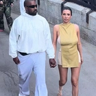 Kanye West sheds his usual all-black look for white sweats while wife Bianca Censori goes BAREFOOT as they join the crowds for Disneyland visit