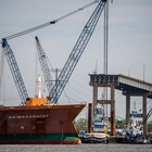 Baltimore bridge collapse: First cargo ship sails through wreckage