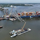 Baltimore bridge span demolished with controlled explosives to free cargo ship