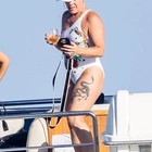 Pink, 44, shows off her toned figure in a stylish white swimsuit during family getaway to Cabo amid break in star's Summer Carnival tour