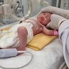 Baby saved from dead mom's womb after Israeli air strike on Gaza dies and is buried next to dad