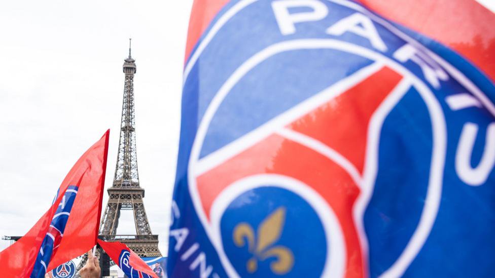 Paris St Germain fans celebrating win the Champions League near the Eiffel Tower in May 2026