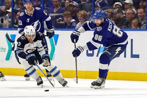Nikita Kucherov makes a pass against the Winnipeg Jets