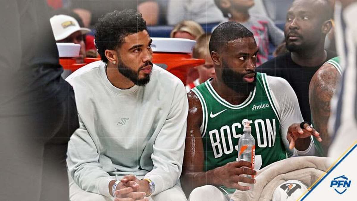 Oct 8, 2025; Memphis, Tennessee, USA; Boston Celtics forward Jayson Tatum (0) and guard Jaylen Brown (7) look on from the bench during the second quarter against the Memphis Grizzlies at FedExForum. © Petre Thomas-Imagn Images