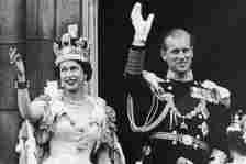 Queen Elizabeth II and the Duke of Edinburgh wave at the crowds from the balcony at Buckingham Palace after the Queen's...