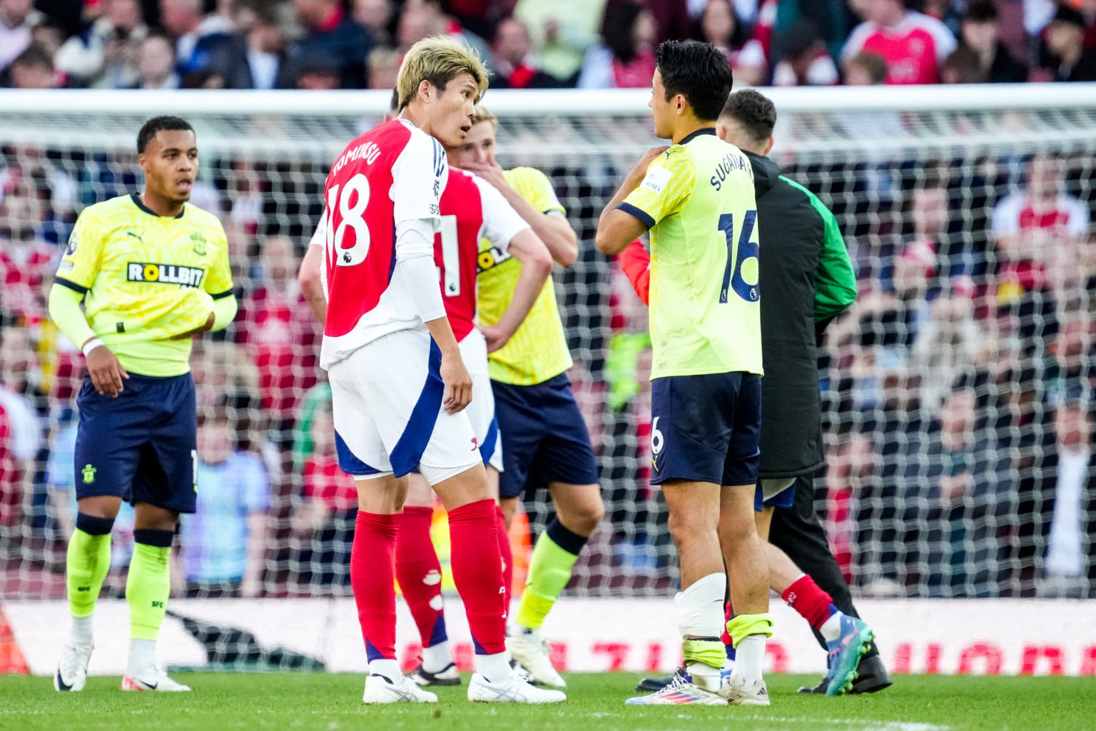 Takehiro Tomiyasu of Arsenal  and Yukinari Sugawara of Southampton exchange shirts after the  Premier League match between Arsenal FC and Southampt...