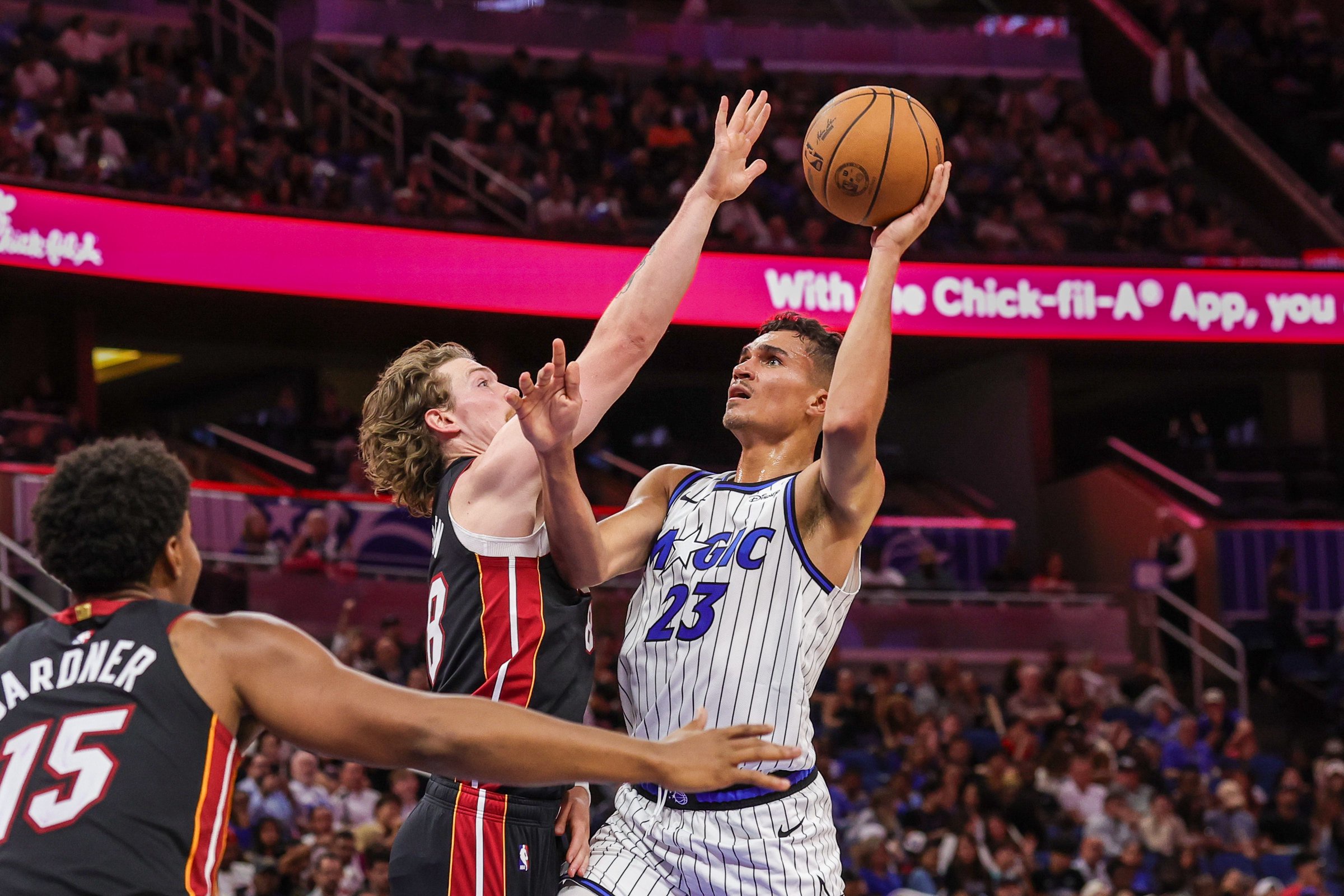 Oct 16, 2026; Orlando, Florida, USA;  Orlando Magic forward Tristan da Silva (23) shoots against Miami Heat guard Gabe Madsen (88) during the second half at Kia Center.  Mandatory Credit: Mike Watters-Imagn Images
