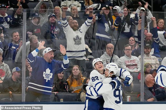 Toronto Maple Leafs defenseman Marshall Rifai (83) celebrates his goal with left wing Gavin McKenna (92) in the third period of an NHL hockey game against the Columbus Blue Jackets in Columbus, Ohio, Tuesday, October. 20, 2026. (AP Photo/Sue Ogrocki)