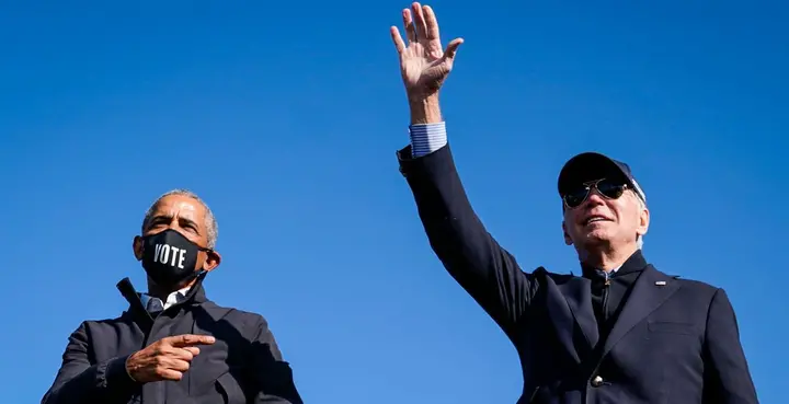 Former President Barack Obama, President Joe Biden during a political rally.