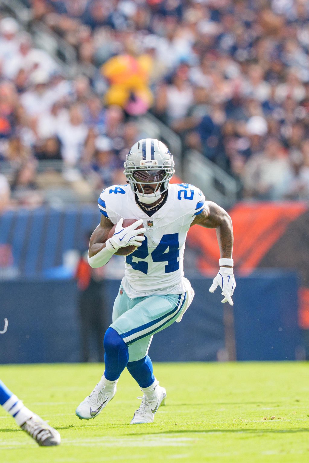 Miles Sanders of the Dallas Cowboys runs the ball during an NFL football game against the Chicago Bears.