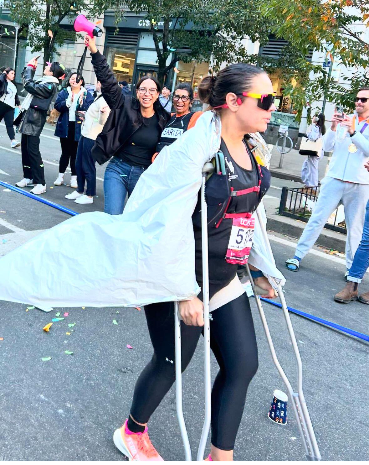 Danielle Grimley finishes the marathon on crutches with a broken hip.