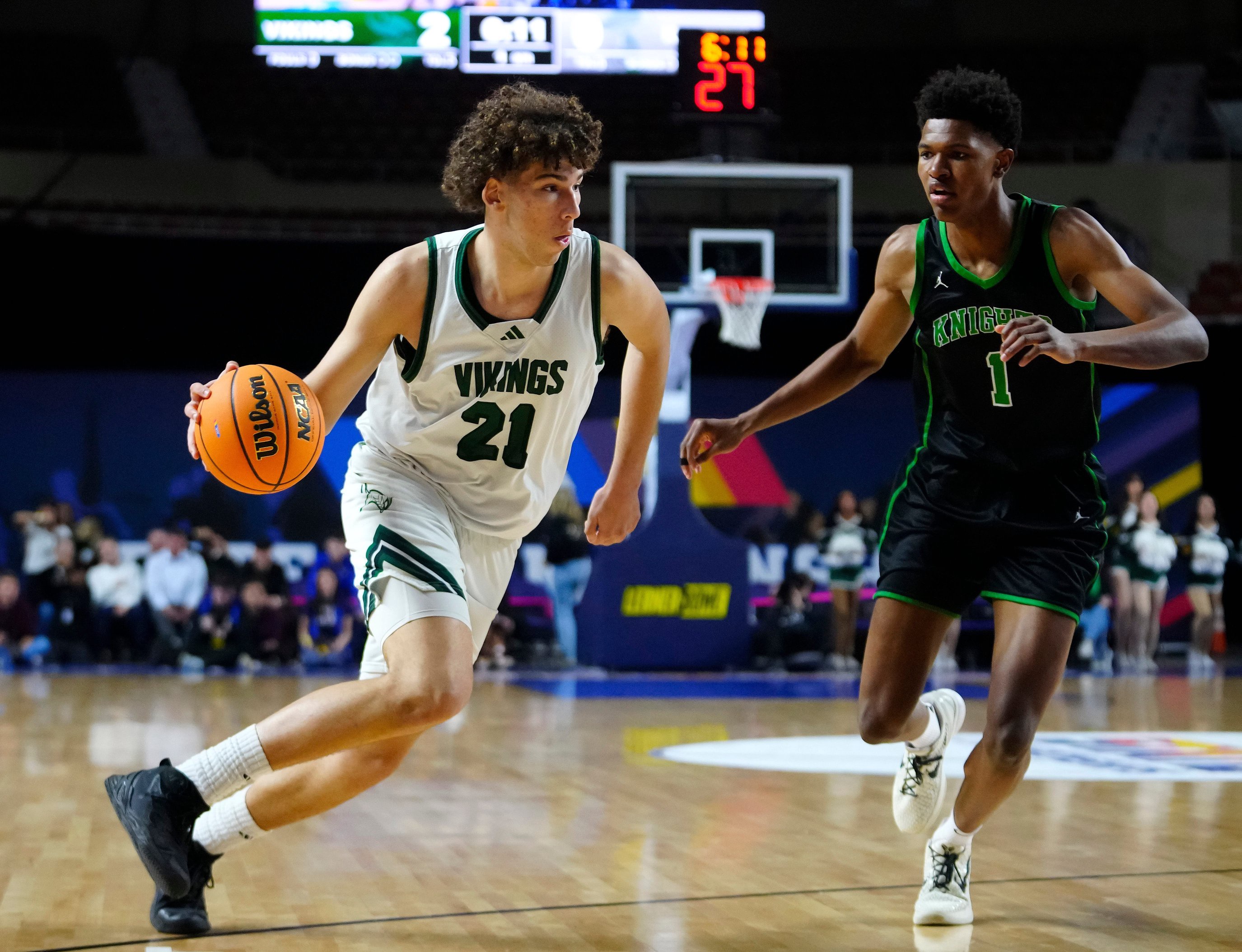 Sunnsylope forward Darius Wabbington (21) drives on St Mary’s forward Cam Williams (1) during the Open Boys Championship game at Arizona Veterans Memorial Coliseum in Phoenix on March 7, 2026.