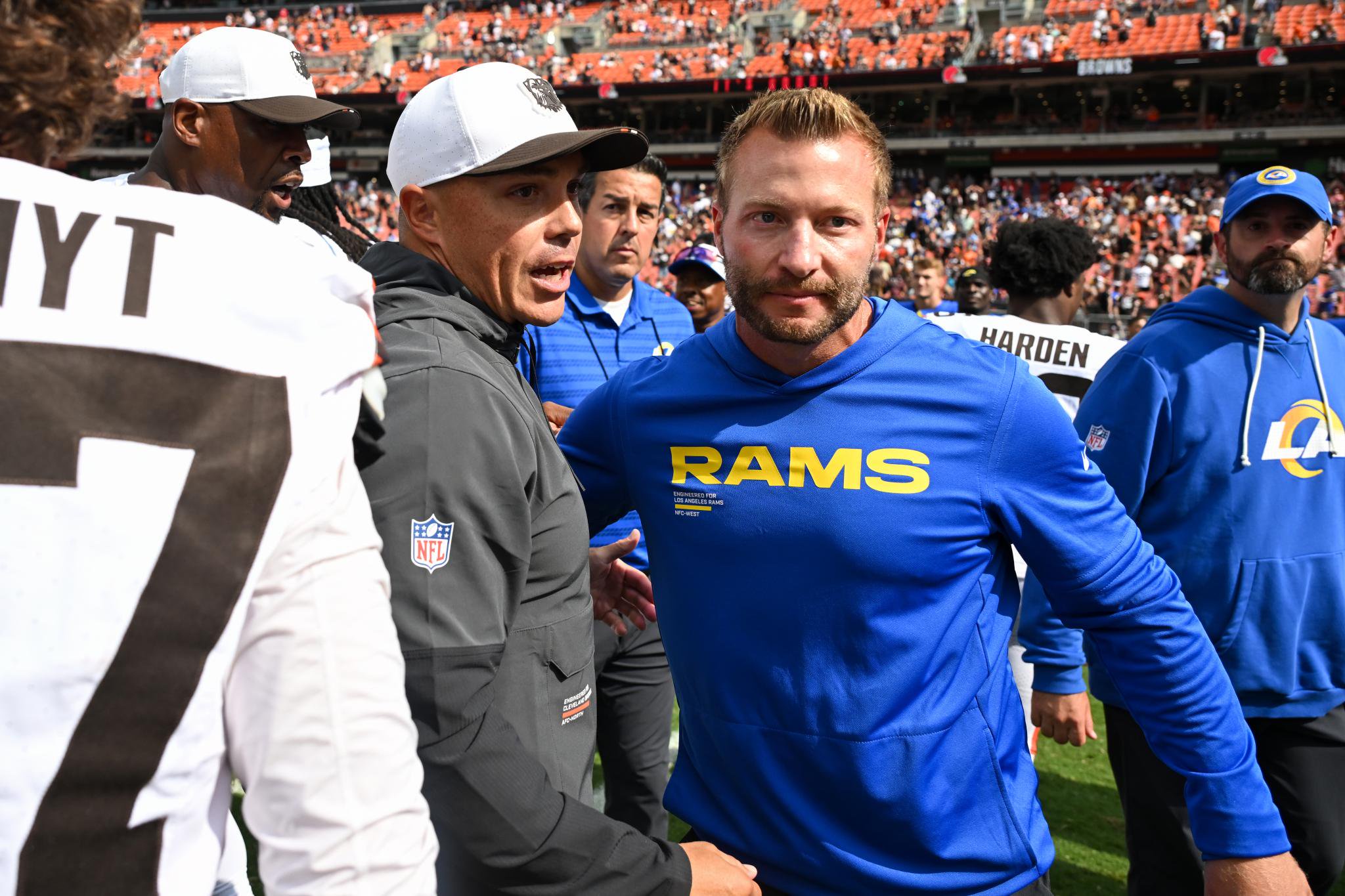 Los Angeles Rams head coach Sean McVay shakes hands with a Cleveland Browns coach on the field before a preseason game.
