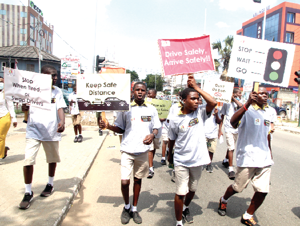 Some schoolchildren embarking on a street campaign for road safety. Picture: ESTHER ADJEI  