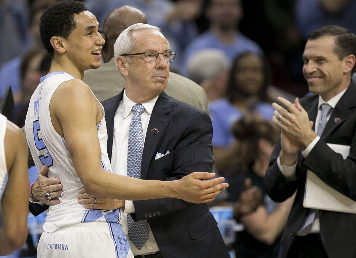 North Carolina coach Roy Williams embraces Marcus Paige as they celebrate the Tar Heels’ 88-74 victory over Notre Dame in the NCAA East Regional Final on March 27, 2016 in Philadelphia.
