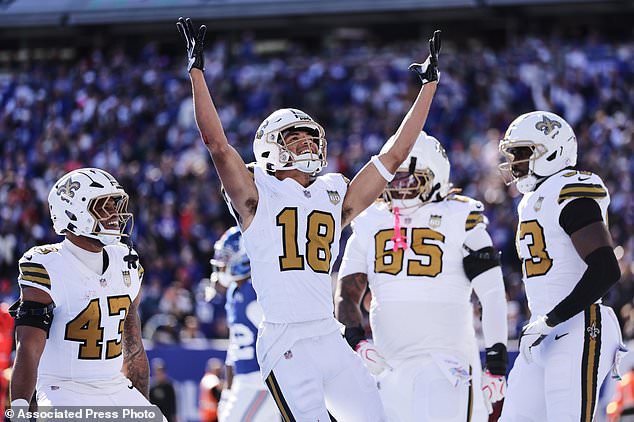 New Orleans Saints wide receiver Bryce Lance (18) celebrates a touchdown during the first half of an NFL football game against the New York Giants in East Rutherford, N.J., Sunday, Oct. 18, 2026. (AP Photo/Adam Hunger)