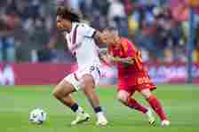 Joshua Zirkzee of Bologna FC and Angelino of AS Roma compete for the ball during the Serie A TIM match between AS Roma and Bologna FC at Stadio Oli...