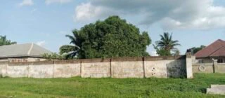 A side view of the church's fence along the expressway. Some of the children at the camp. Some of the cars parked inside the premises. A side view of the church from the Expressway Some of the people at the camp. The ICIR/Marcus Fatunmole
