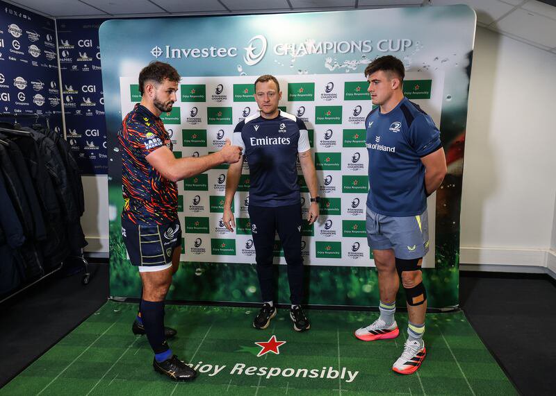 ASM Clermont Auvergne's Harry Plummer, Referee Matthew Carley and Leinster's Dan Sheehan at the coin toss ahead of the match. Photograph: Ben Brady/Inpho