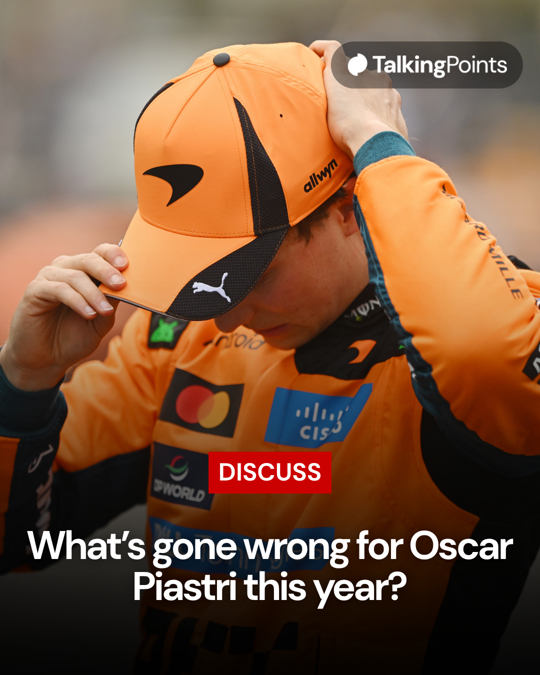 Oscar Piastri of McLaren adjusts his cap
