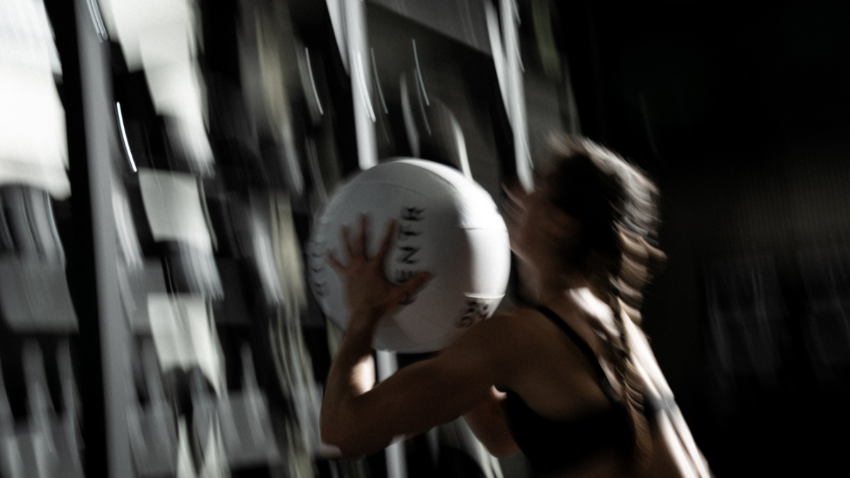 Athlete doing wall balls TDEE Calculator