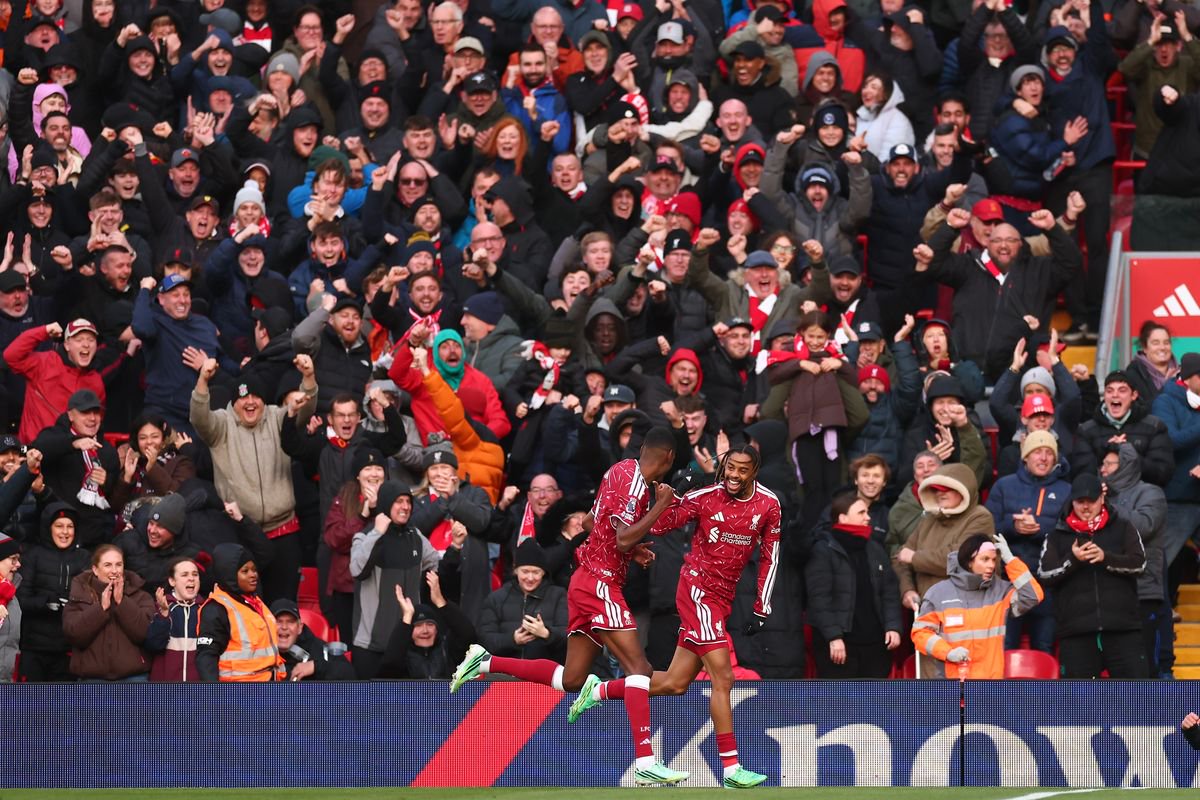 Alexander Isak celebrates with Bradley Barcola after scoring for Liverpool against Brighton.