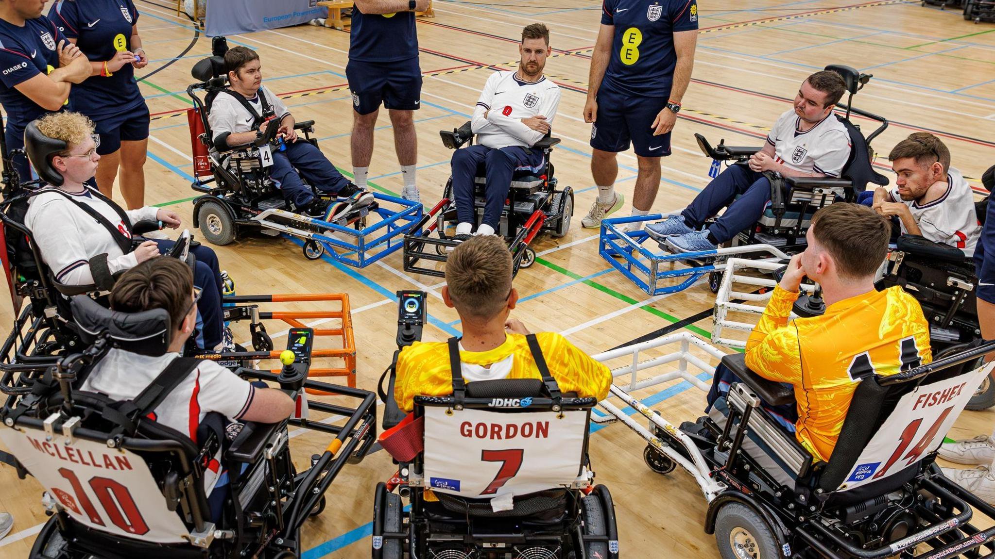 The England team sit together in a circle at a tournament in July 2026