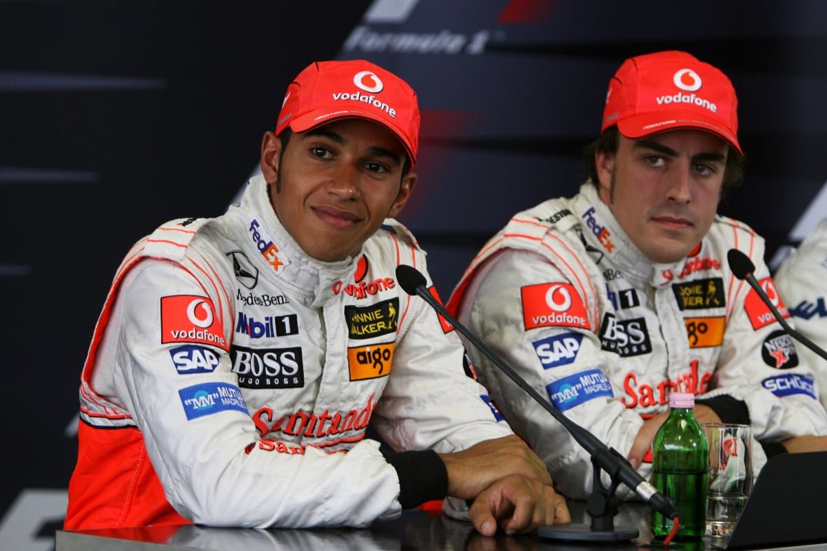 McLaren's Lewis Hamilton and Fernando Alonso look on from a 2007 Hungarian Grand Prix press conference — Photo: © IMAGO
