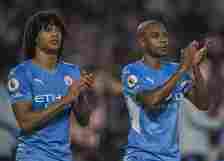 Manchester City's Nathan Ake (left) and Fernandinho (right) applauds the fans at the final whistle  during the Premier League match between Brentfo...