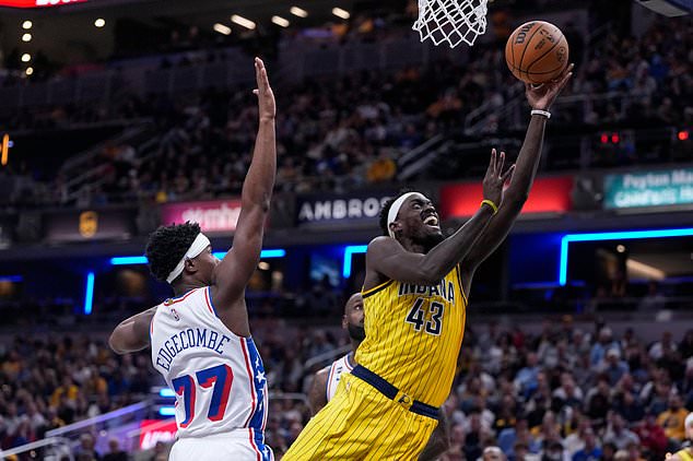 Indiana Pacers forward Pascal Siakam (43) shoots in front of Philadelphia 76ers guard Vj Edgecombe (77) during the first half of an NBA basketball game in Indianapolis, Wednesday, Oct. 28, 2026. (AP Photo/Michael Conroy)