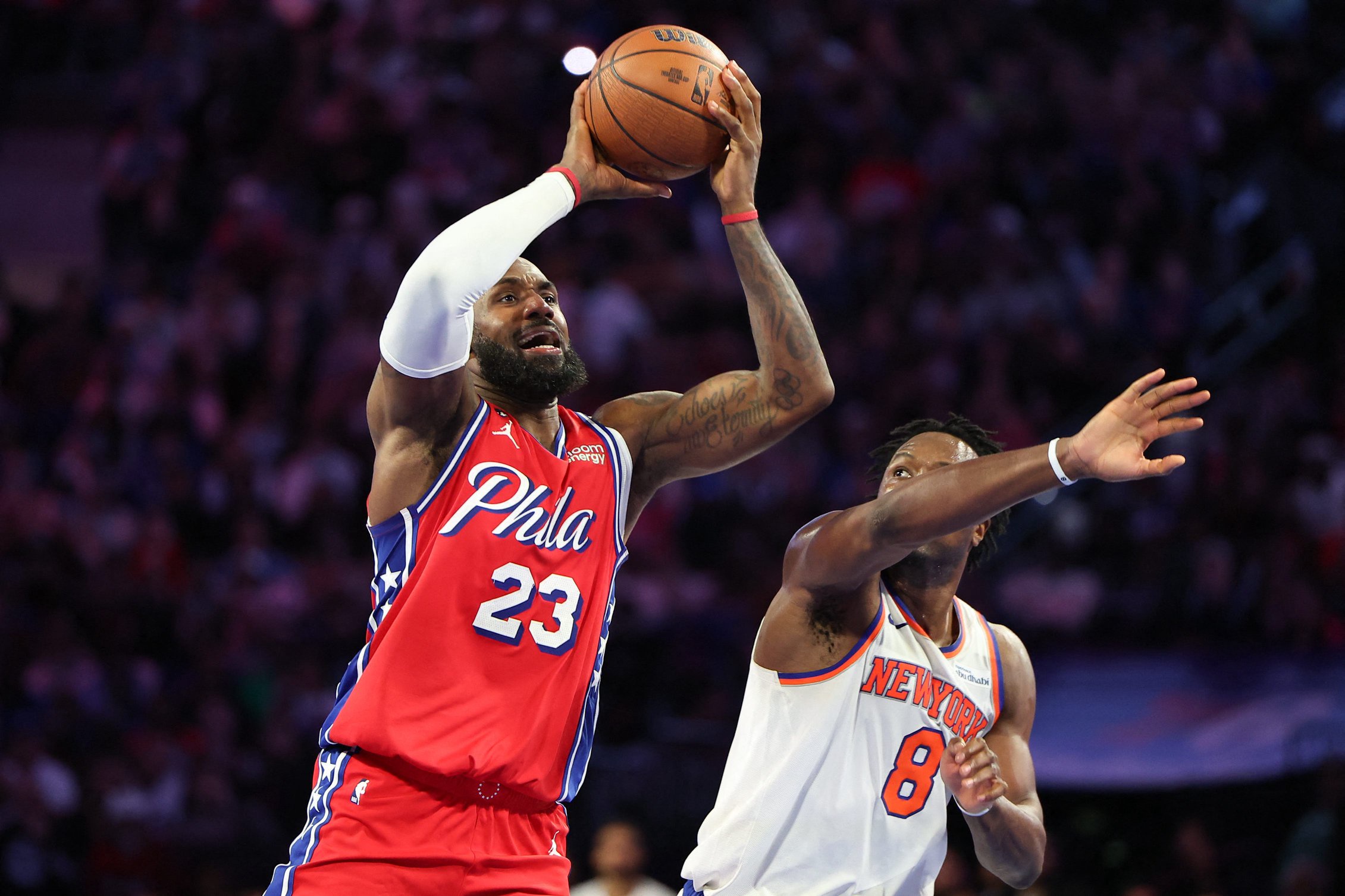 Oct 30, 2026; Philadelphia, Pennsylvania, USA; Philadelphia 76ers forward LeBron James (23) drives for a shot against New York Knicks forward Og Anunoby (8) during the fourth quarter at Xfinity Mobile Arena. Mandatory Credit: Bill Streicher-Imagn Images