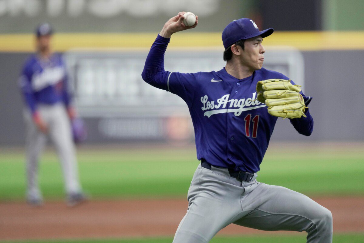 Los Angeles Dodgers pitcher Roki Sasaki (11) commits a throwing error during the first inning of their game against the Milwaukee Brewers Saturday, May 23, 2026 at American Family Field in Milwaukee, Wisconsin.