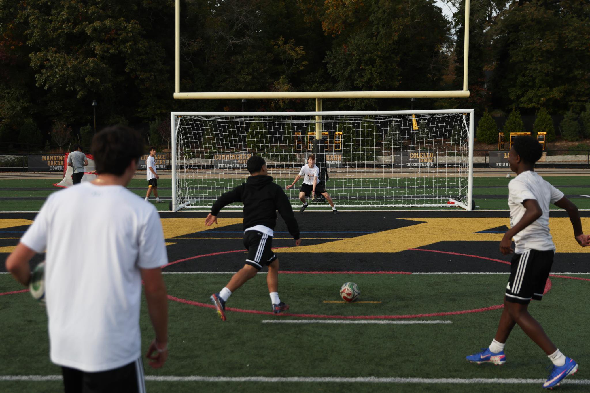 Players on the St. Anthony's boys soccer team run drills during practice.