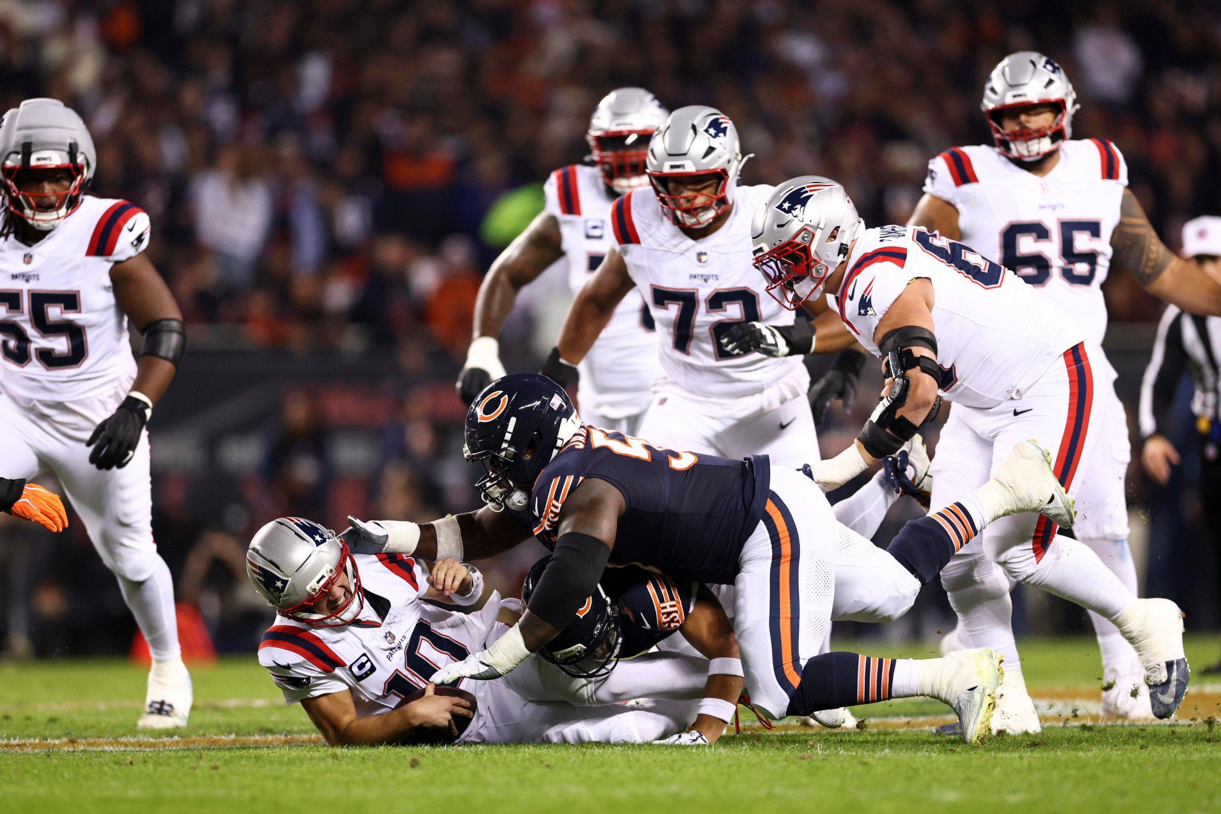 CHICAGO, ILLINOIS - OCTOBER 22: Kyler Gordon #6 of the Chicago Bears sacks Drake Maye #10 of the New England Patriots during the first quarter of an NFL football game at Soldier Field on October 22, 2026 in Chicago, Illinois. (Photo by Kevin Sabitus/Getty Images)