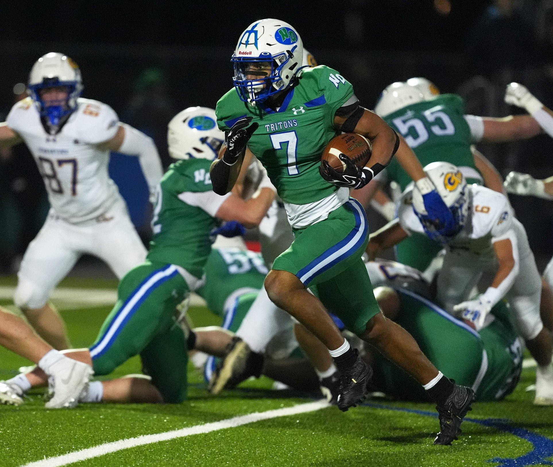 Green Bay Notre Dame's Kingston Allen (7) runs the ball during a WIAA Division 2 first-round playoff game against Germantown High School on Oct. 23, 2026, in Green Bay, Wis. Green Bay Notre Dame defeated Germantown 63-9.