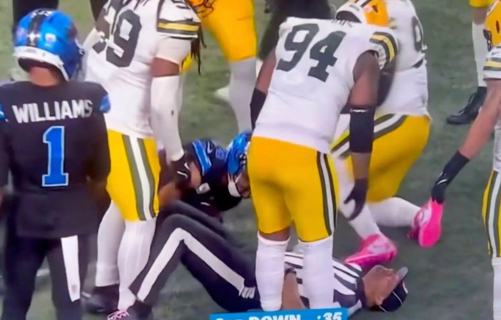 An image collage containing 1 images, Image 1 shows Football players surrounding a fallen player and a referee on the field