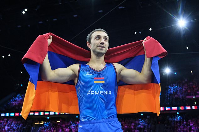Artur Davtyan, of Armenia, celebrates after winning the gold medal in the vault during the apparatus finals at the Artistic Gymnastics World Championships in Rotterdam, the Netherlands, Sunday, Oct. 25, 2026. (AP Photo/Patrick Post)