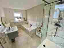 The house is fitted with a stylish bathroom