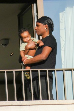 Paris, FRANCE - *EXCLUSIVE* - ASAP Rocky holds his son as he flips the bird from the balcony of the Bulgari Hotel in Paris. Pictured: ASAP Rocky BACKGRID USA 16 APRIL 2023 BYLINE MUST READ: BACKGRID USA: +1 310 798 9111 / usasales@backgrid.com UK: +44 208 344 2007 / uksales@backgrid.com *UK Clients - Pictures Containing Children Please Pixelate Face Prior To Publication*
