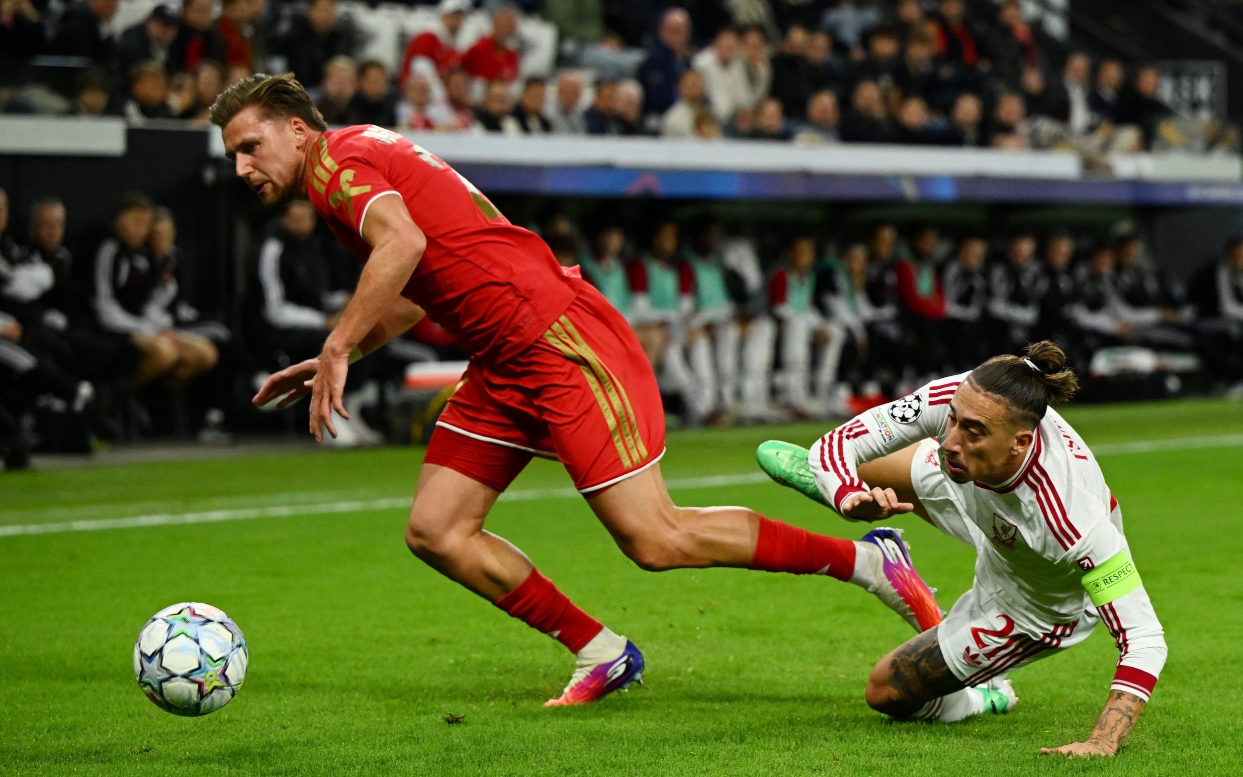 Kasper Jorgensen in action with Liverpool's Kostas Tsimikas