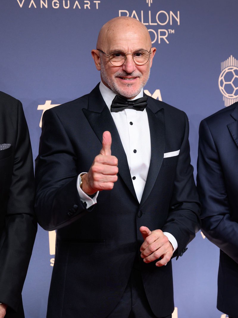 Image may contain Body Part Finger Hand Person Clothing Formal Wear Suit Adult Coat Jacket Blazer and Tuxedo
