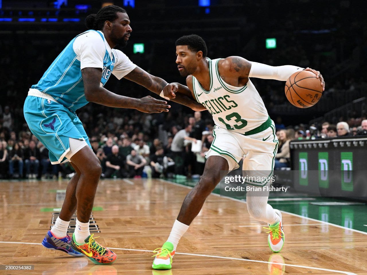 Paul George of the Boston Celtics goes to the basket against Naz Reid of the Charlotte Hornets during their preseason game. (Photo by Brian Fluharty/Getty Images)