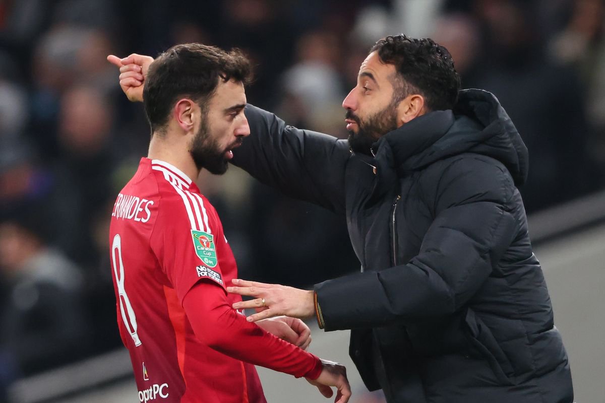 Manchester United manager Ruben Amorim with Bruno Fernandes during the Carabao Cup Quarter Final match between Tottenham Hotspur and Manchester United at Tottenham Hotspur Stadium on December 19, 2024 in London, England