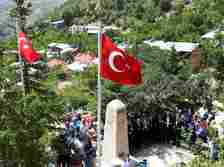 People attend a commemoration ceremony around a memorial to the PKK victims in Başbağlar, Erzincan, eastern Türkiye, July 1, 2024. (IHA Photo)