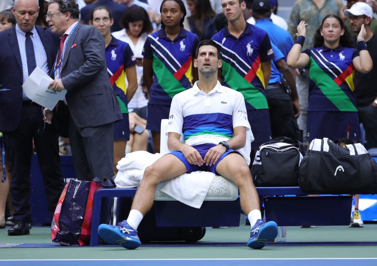 Novak Djokovic sits down at the US Open.