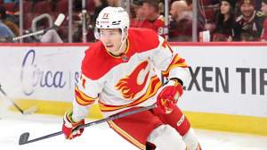 Walker Duehr #71 of the Calgary Flames skates against the Chicago Blackhawks during the first period at the United Center on January 13, 2025 in Chicago, Illinois.