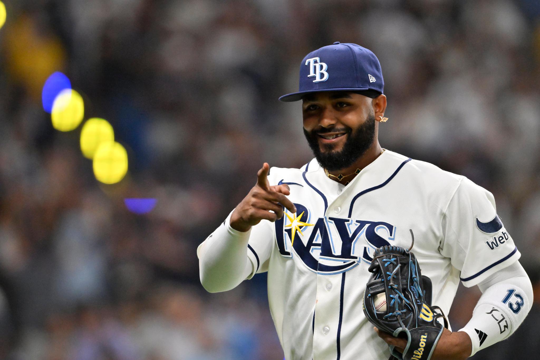 Tampa Bay Rays third baseman Junior Caminero points and smiles during the ALDS.