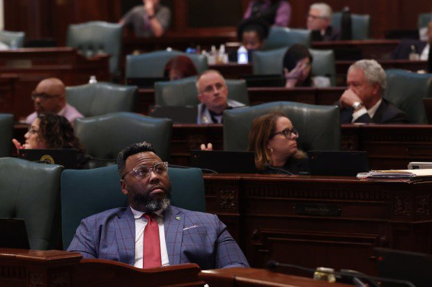 State Rep. Kam Buckner sits at his desk as a revenue component of the budget bill is passed on the House floor during the final night of the spring legislative session at the State Capitol Sunday on May 31, 2026, in Springfield. (John J. Kim/Chicago Tribune)